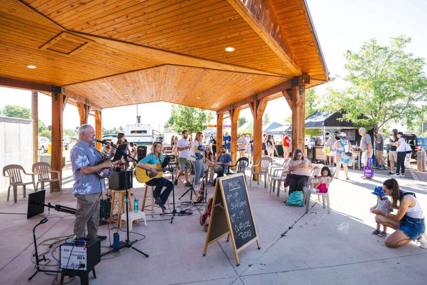People with interests and other materials stand under Gazebo when people travel near many dealers have established merchants.