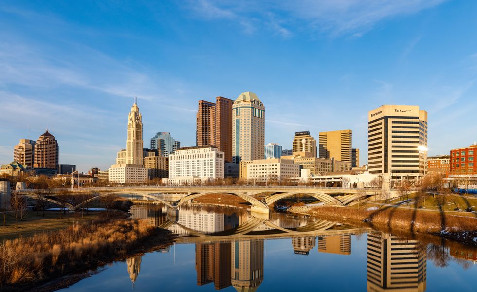 Columbus Ohio Downtown Skyline as seen from the shores of the SCioto River in the winter evening winter evenings
